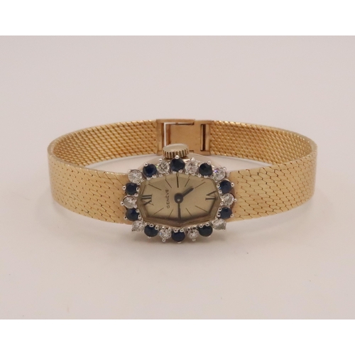 302 - A sapphire and diamond Geneve cocktail watch. Stamped 14K. Weight 30.44 grams.