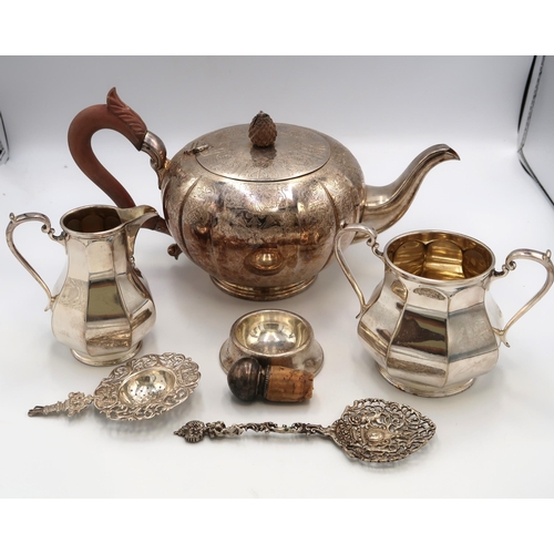 354 - Dutch 830 silver, comprising tea strainer, of scrolling foliate form with two pictorial panels, make... 