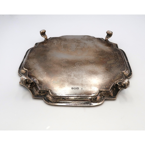 362 - A late Victorian silver salver, with pie-crust rim, raised on four scroll feet, Charles Stuart Harri... 