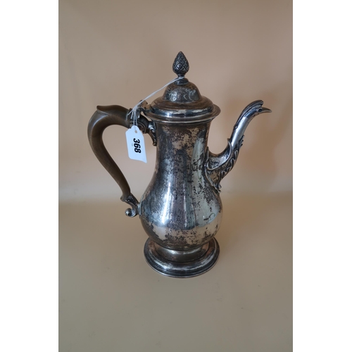 368 - A George III Newcastle silver coffee pot of baluster form with fruitwood handle and pineapple finial... 