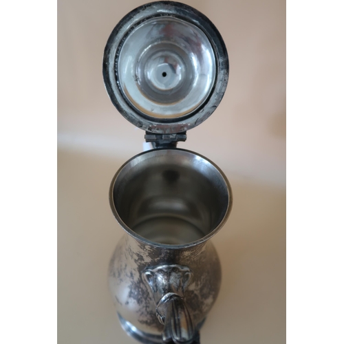 368 - A George III Newcastle silver coffee pot of baluster form with fruitwood handle and pineapple finial... 