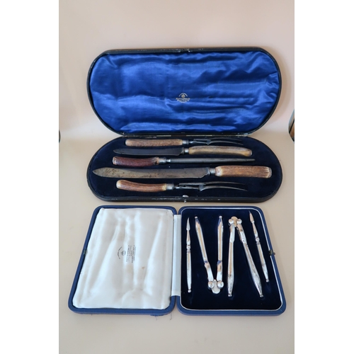372 - A Mappin and Webb vintage steel carving set with silver collars and stag-horn handles, comprising st... 