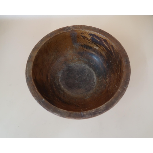 501 - An Irish wooden salad bowl, carved with with gallic inscription above Celtic knotwork animal panels,... 