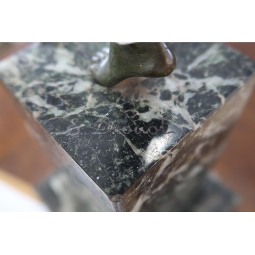 506 - Edouard Drouot (1859-1945): a bronze figure of pan playing his pipes and dancing, on rectangular mar... 