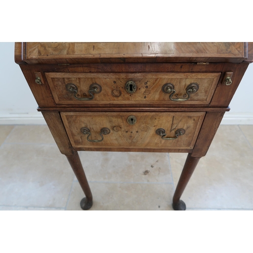 634 - An antique burr walnut bureau and fitted interior over two drawers, 18th century and later, 50cm wid... 