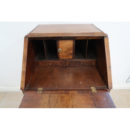 634 - An antique burr walnut bureau and fitted interior over two drawers, 18th century and later, 50cm wid... 