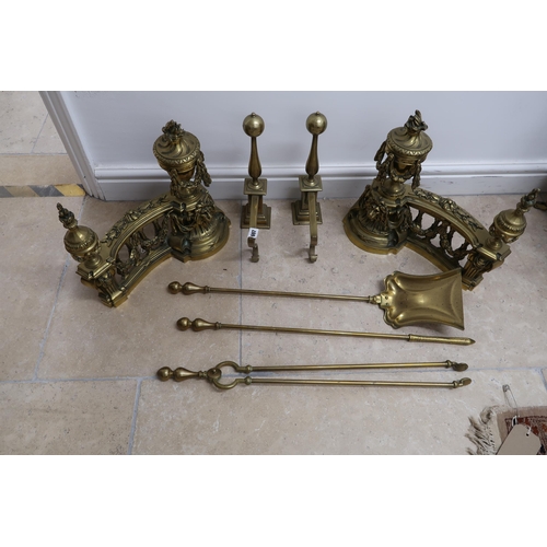 697 - A set of 19th century brass fire irons and two sets of fire dogs