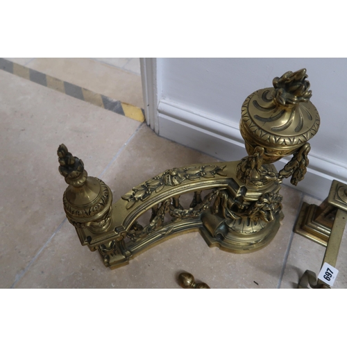 697 - A set of 19th century brass fire irons and two sets of fire dogs