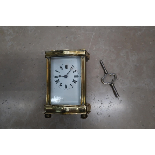 701 - A brass 8 day carriage clock