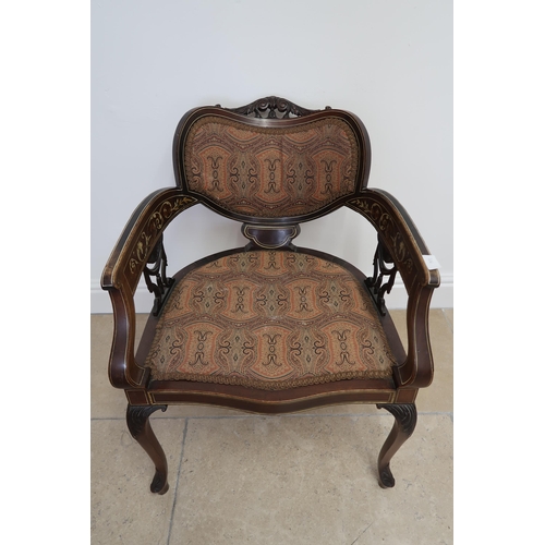 706 - An Edwardian mahogany and inlaid chair