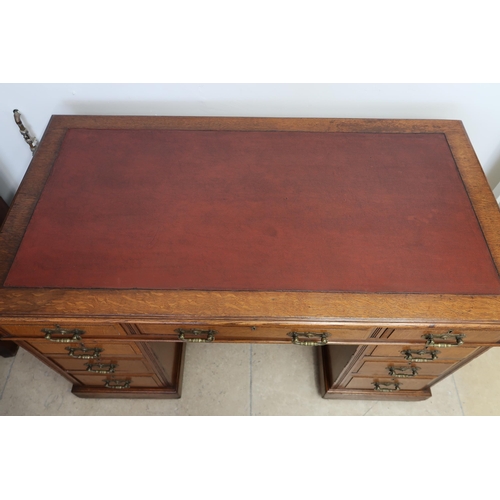 711 - A Victorian nine drawer pedestal desk with writing scriber - in good condition - Width 122cm x Depth... 