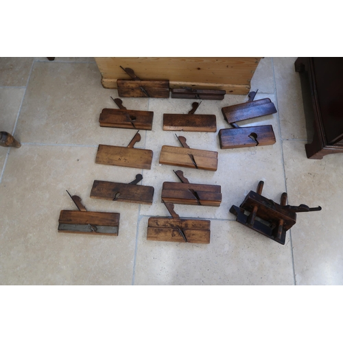 712 - A 19th century pine chest with a collection of early woodworking tools