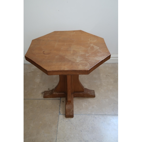 714 - Robert Mouseman Thompson - An oak octagonal coffee table with carved mouse signature - Height 48cm