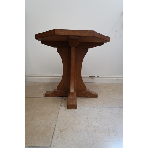 714 - Robert Mouseman Thompson - An oak octagonal coffee table with carved mouse signature - Height 48cm