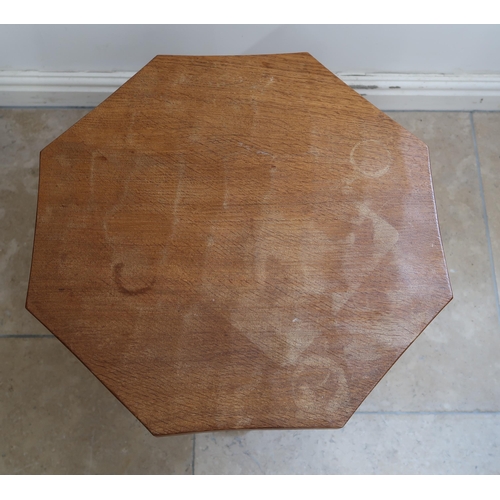 714 - Robert Mouseman Thompson - An oak octagonal coffee table with carved mouse signature - Height 48cm