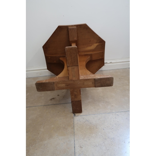714 - Robert Mouseman Thompson - An oak octagonal coffee table with carved mouse signature - Height 48cm