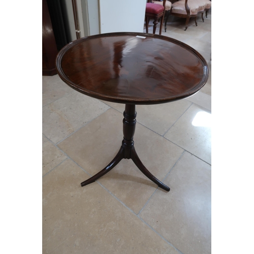 718 - A 19th century mahogany tripod table with a 56cm diameter dished top