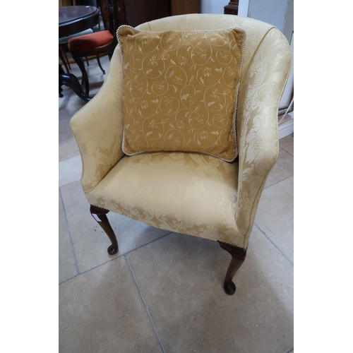 720 - A 1950's upholstered armchair and cushion