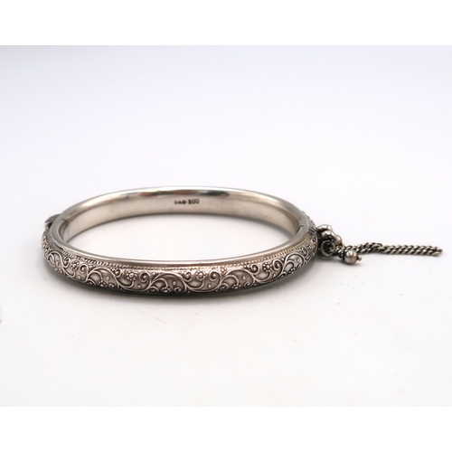 78 - A Finely Engraved Antique Silver Bangle, Internal Dimensions approx. 58mm x 49mm