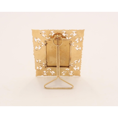 99 - An 18ct Tested Madonna & Child Pendant with stand, featuring an elaborately worked border. 

Stamped... 