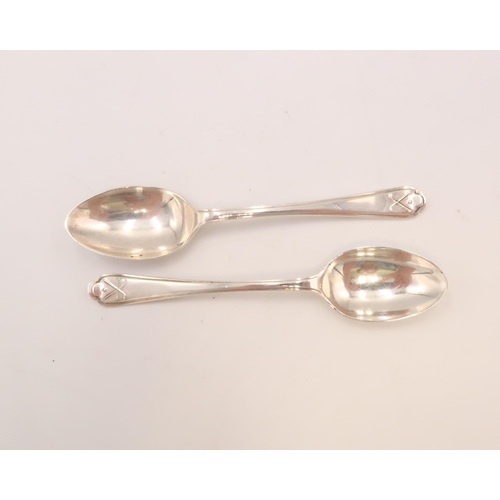 351 - A pair of silver golfing teaspoons, the reeded handles, with trefoil finial having a pair of crossed... 