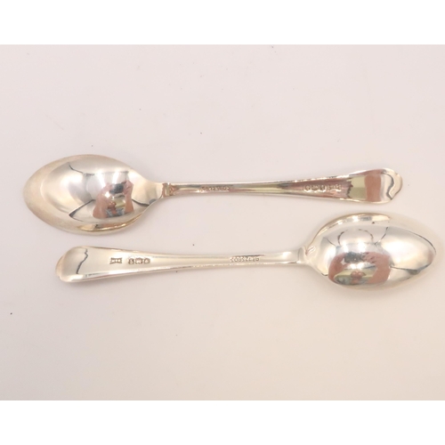 351 - A pair of silver golfing teaspoons, the reeded handles, with trefoil finial having a pair of crossed... 