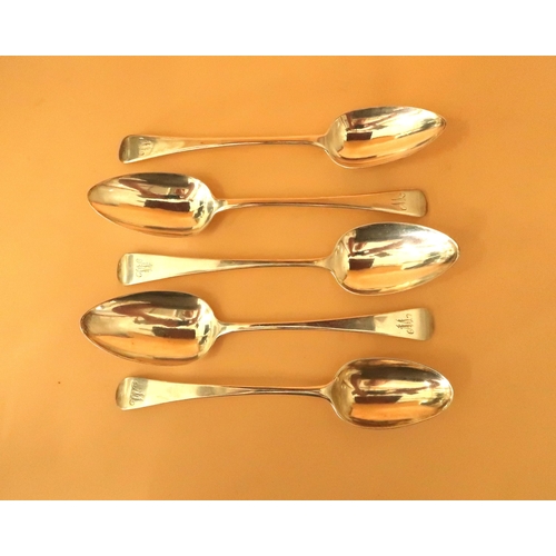 377 - A set of four George III silver serving spoons, in the Hanovarian pattern, all monogram engraved, Th... 