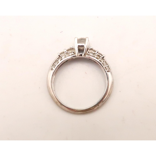 98 - A 14ct white gold, and diamond ring the central diamond of approximately 4.3mm diameter, 0.3ct with ... 