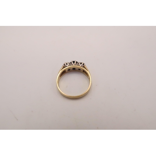 118 - An 18ct gold, sapphire and diamond three stone ring, the central dark blue sapphire of approximately... 