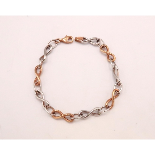 119 - A 9ct bi-coloured gold bracelet with rose and white gold delicate figure-of-eight loops, 18.5cm long... 