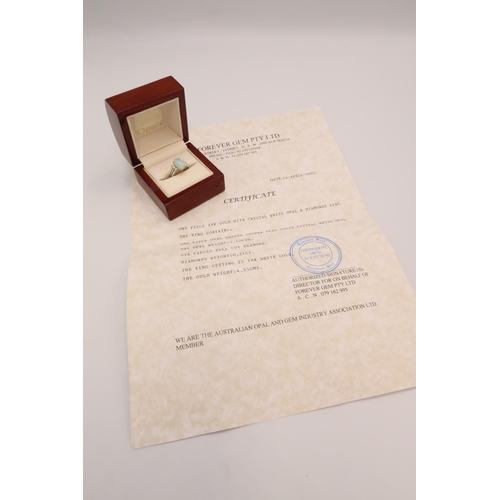 93 - An 18ct white gold, diamond and opal dress ring, the opal from Coober Pedy, Australia, with good mov... 