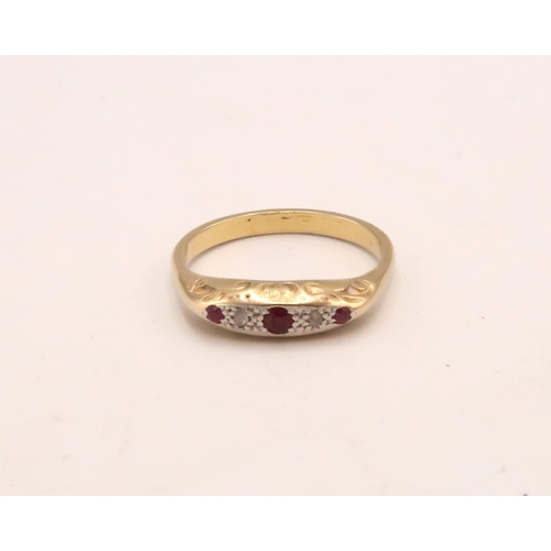 97 - A ruby and diamond boat shape ring. Tests gold 18ct. Size Q. Weight 3.03 grams