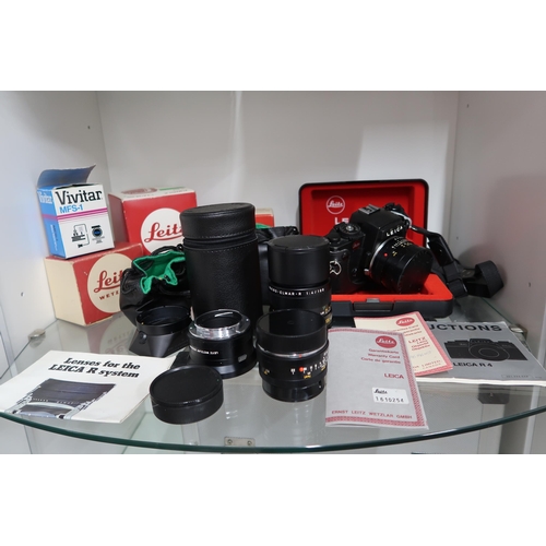 531 - A Leica R4 Camera with original case and assessories to include aditional lenses, filters, tripods a... 