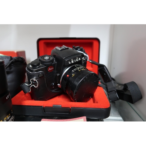 531 - A Leica R4 Camera with original case and assessories to include aditional lenses, filters, tripods a... 