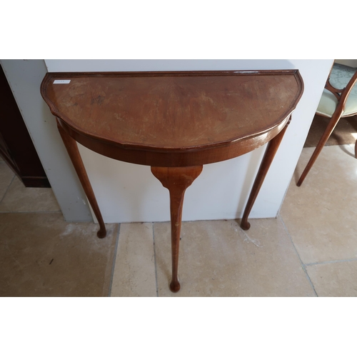 723 - A Walnut Demi Lune side table. 

Height: 72cm