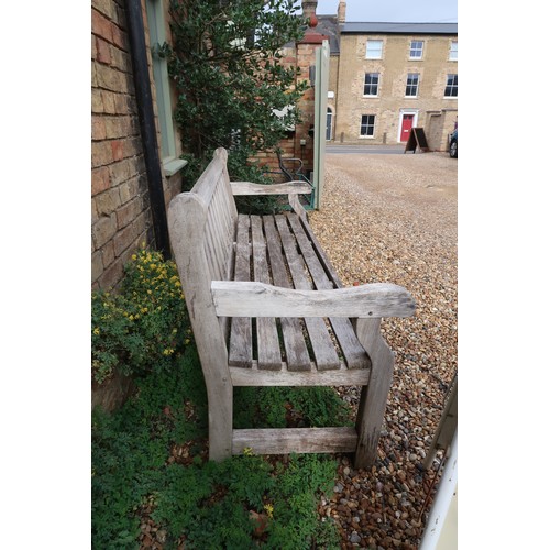 601A - A very good quality teak weathered bench inscribed The Well House - 182cm/6ft wide - in sound condit... 