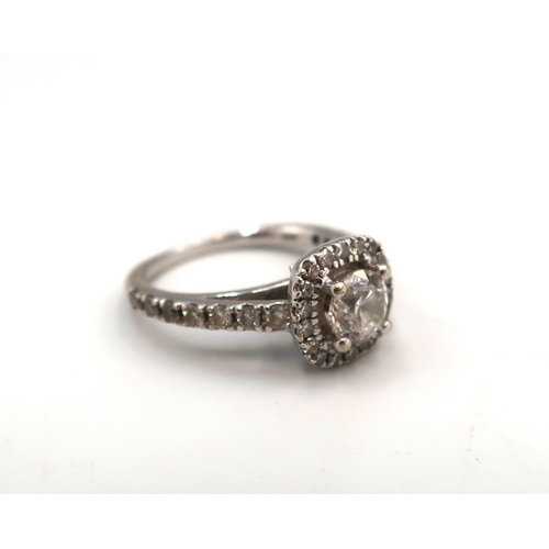 12 - A 14ct Diamond Halo Cluster style ring, with diamond set shoulders. 

Approximate total diamond weig... 