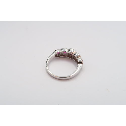17 - An 18ct gold graduated ruby and diamond cluster ring. Size N. Weight 3.71 grams