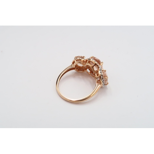24 - A 9ct gold morganite and diamond triple cluster ring. Size  M 1/2. Weight 3.07 grams
