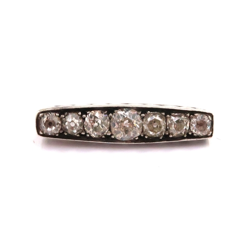An Edwardian Platinum & 14ct Seven Old Cut Diamond brooch, Approximately 2.0ct

Uhnallmarked, tests 14ct & Platinum.
Weight: 3.2g 
Centre approximately stone 5.4mm x 3.2mm  .61ct.

Condition: Overall in good condition, pin functions and stones appear secure. 

(Matches Design with lot 11)