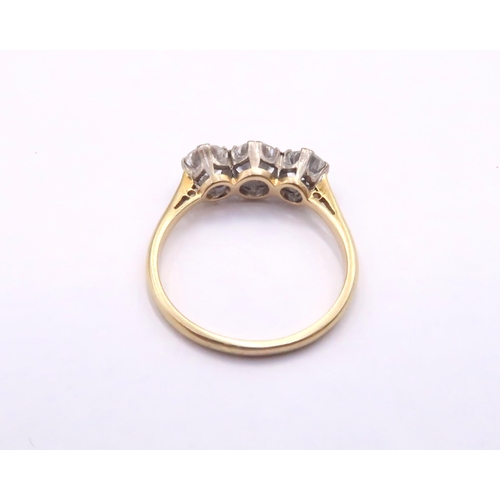 15 - An 18ct Diamond Three Stone, approximate diamond content 1.4ct, G/H VVS1/2.

Weight: 3g Size: Q

Dia... 