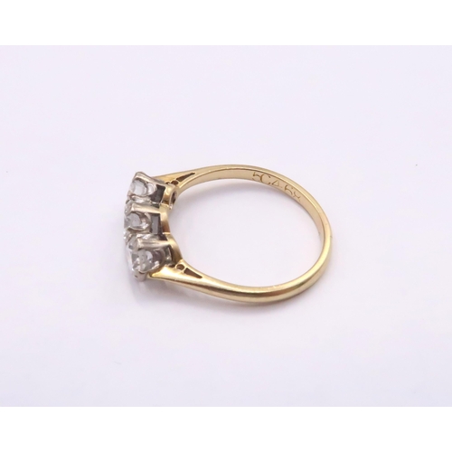 15 - An 18ct Diamond Three Stone, approximate diamond content 1.4ct, G/H VVS1/2.

Weight: 3g Size: Q

Dia... 