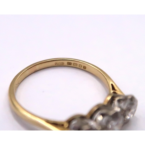 15 - An 18ct Diamond Three Stone, approximate diamond content 1.4ct, G/H VVS1/2.

Weight: 3g Size: Q

Dia... 