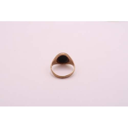 28 - A 9ct Onyx Signet Ring. 

Weight: 5.5g Size: R

Condition : Overall ring is in good order.