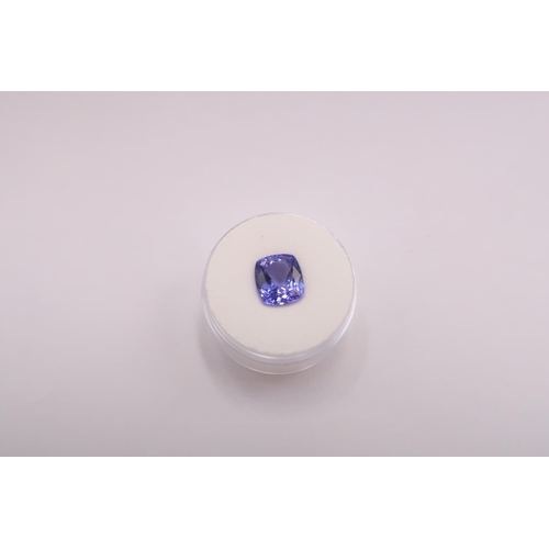 46 - A loose cushion shape tanzanite. Accompanied by a Gem Collector report stating 3.50cts. Colour AAA