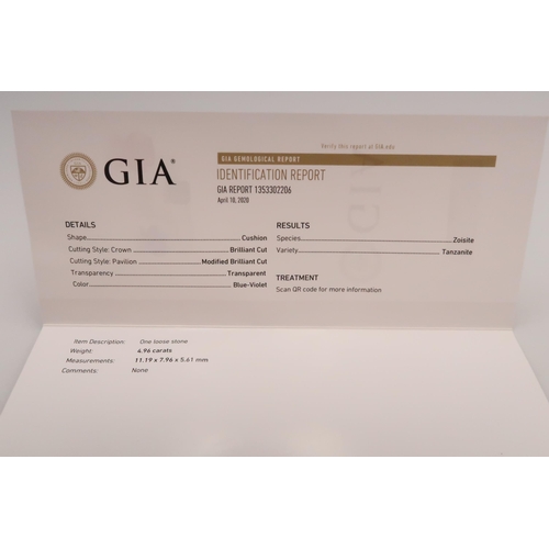 50 - A cushion cut tanzanite. With GIA certificate stating 4.96cts