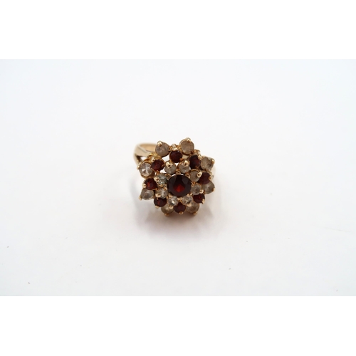63 - A 9ct Garnet & White stone cluster ring. 

Weight: 4.65g Size: L 

Condition: Head and shank of ring... 