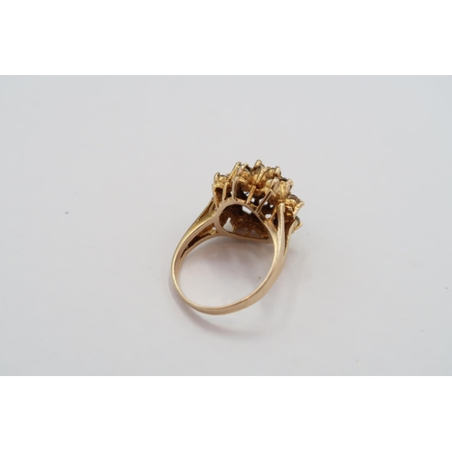 63 - A 9ct Garnet & White stone cluster ring. 

Weight: 4.65g Size: L 

Condition: Head and shank of ring... 