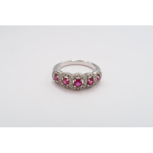 17 - An 18ct gold graduated ruby and diamond cluster ring. Size N. Weight 3.71 grams