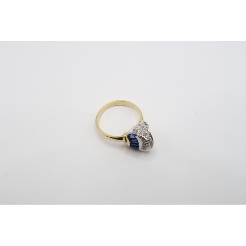 2 - An 18ct Gold Sapphire & Diamond ring, head individually set with tapered baguette sapphires with rou... 